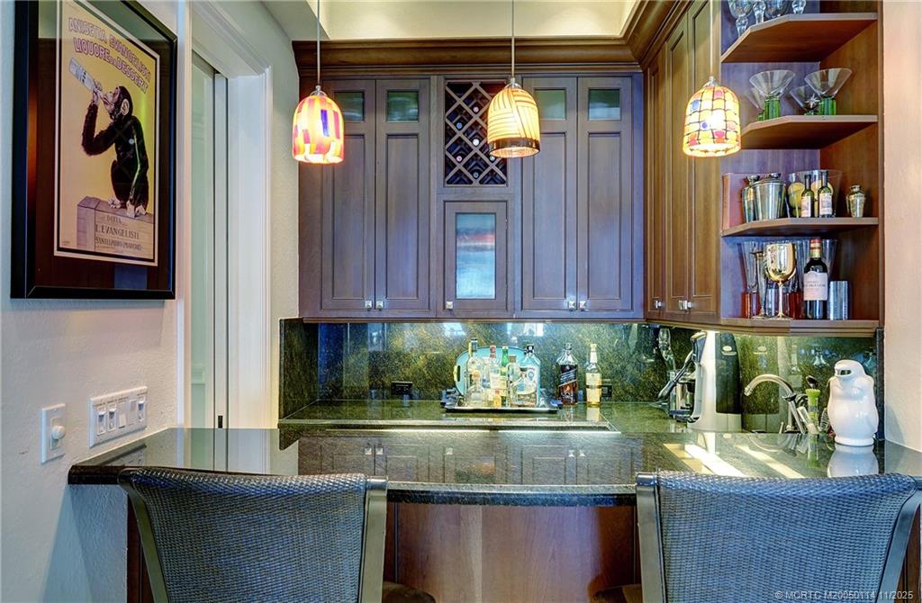 31 North River Road Stuart, FL 34996 - Photo 16 of 91 a kitchen with stainless steel appliances granite countertop a sink and a granite counter tops