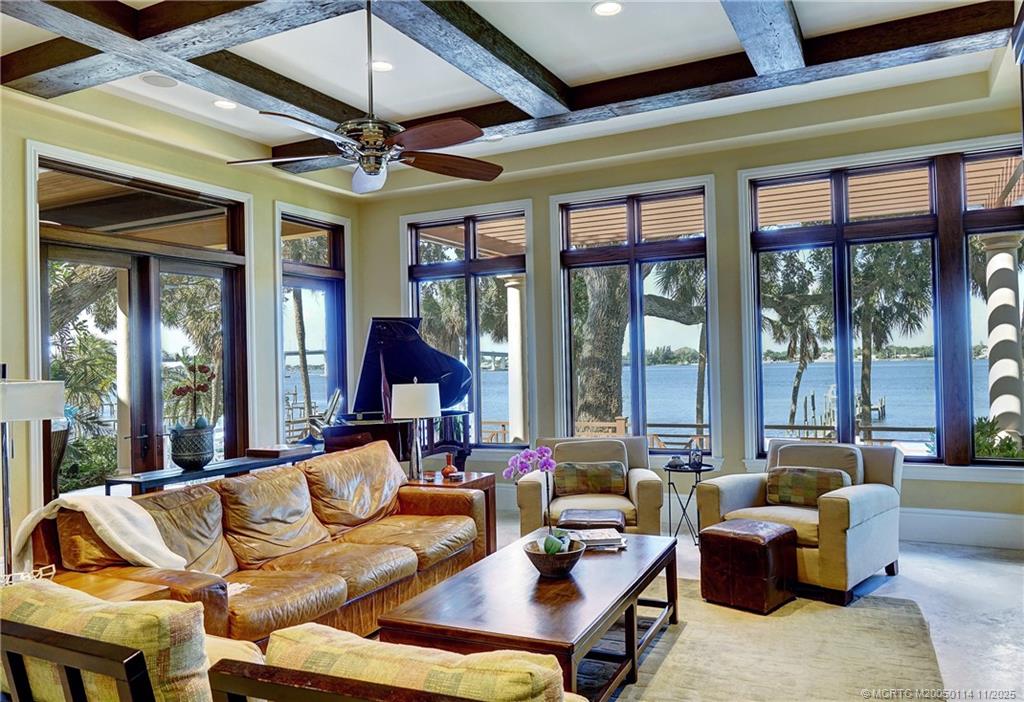 31 North River Road Stuart, FL 34996 - Photo 27 of 91 a living room with furniture ceiling fan and a large window