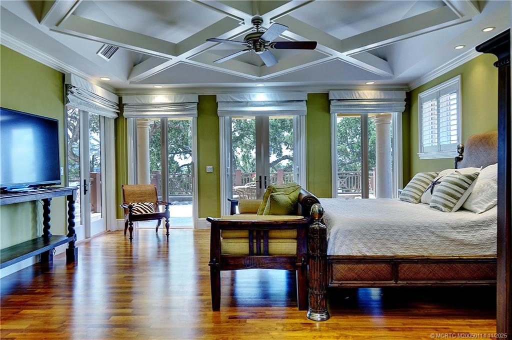 31 North River Road Stuart, FL 34996 - Photo 43 of 91 a living room with furniture flat screen tv and wooden floor