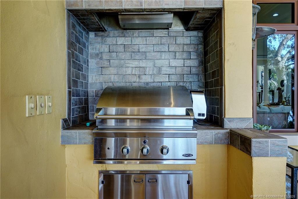 31 North River Road Stuart, FL 34996 - Photo 64 of 91 a stove top oven sitting inside of a kitchen
