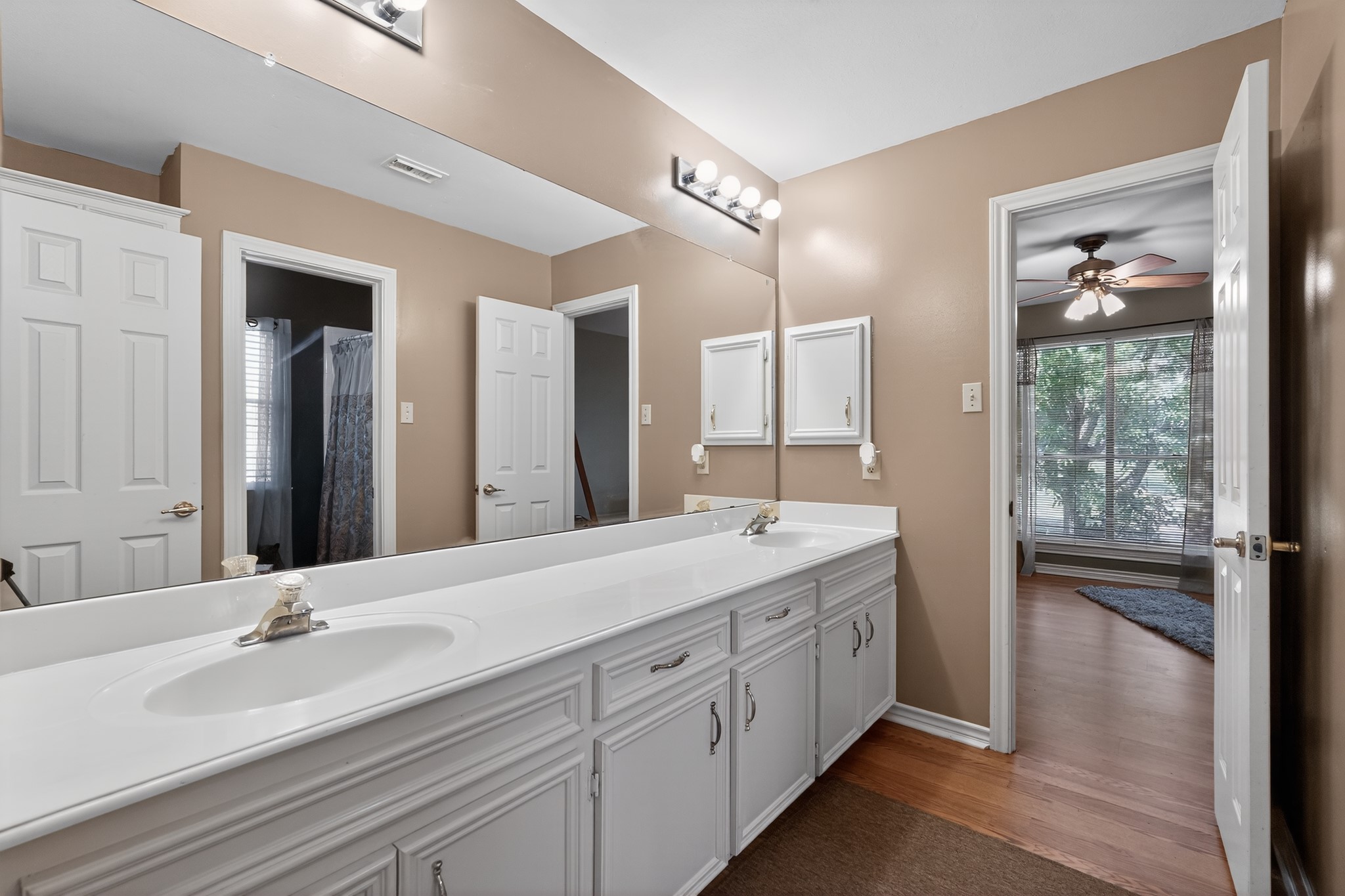 19027 Relay Road Humble, TX 77346 - Photo 22 of 29 Jack and Jill bathroom featuring dual vanity sinks.