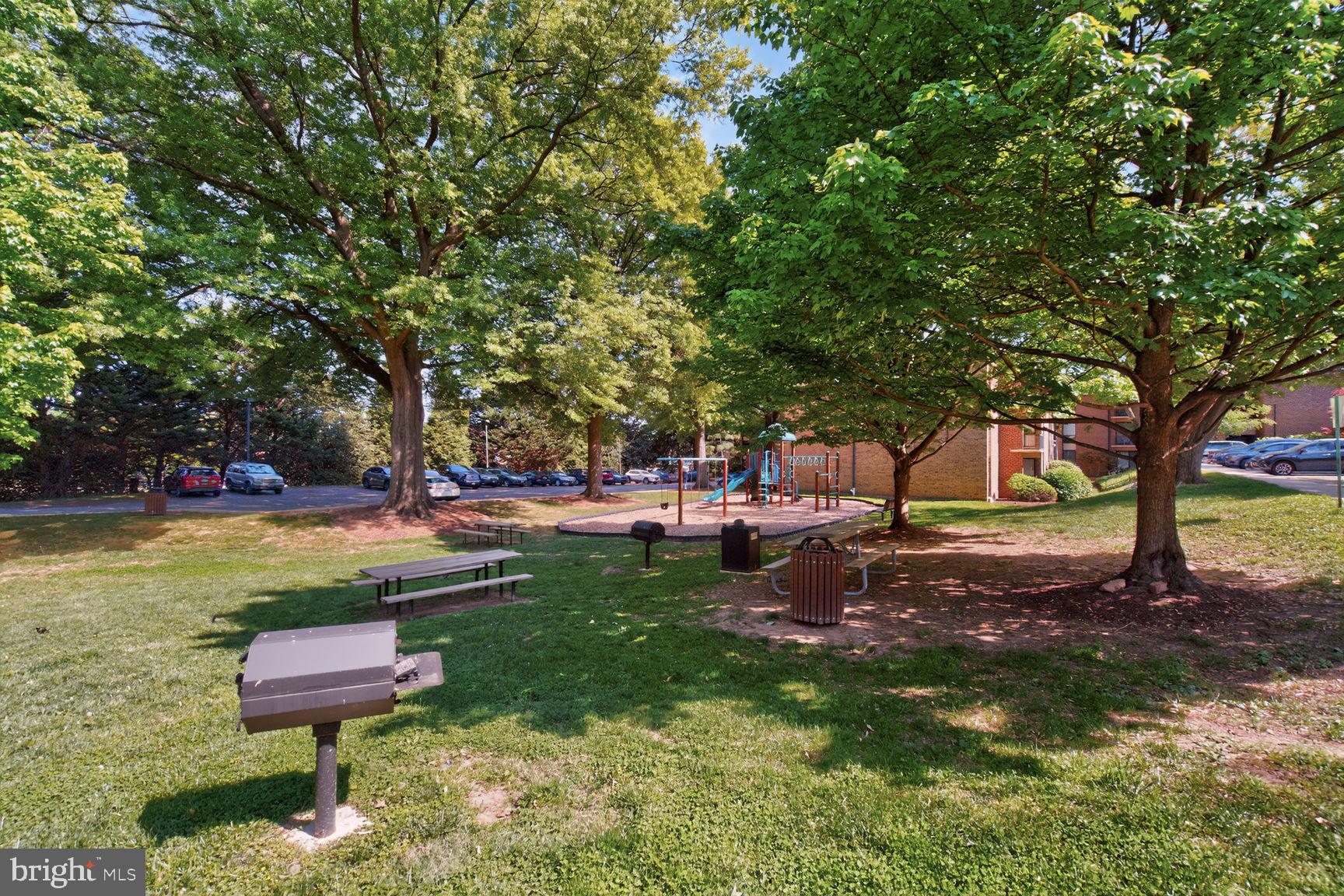 2004 Coleridge Drive, Unit 20201 Silver Spring, MD 20902 - Photo 19 of 26 Playground and grills right outside the condo.