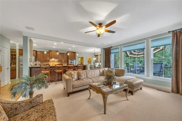 a view of a dining room and hall with furniture