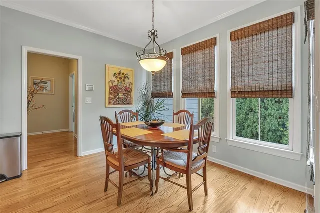 a large kitchen with stainless steel appliances lots of counter space and a sink