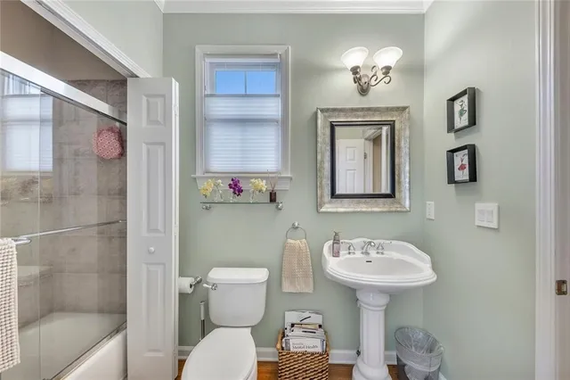 a large bathroom with a double vanity sink a mirror and a bathtub