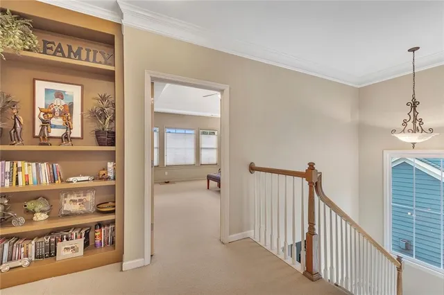 a spacious bedroom with a bed and a large window
