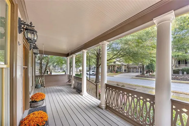 a view of a room with wooden floor and iron stairs