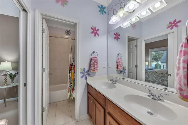 a view of small house with wooden fence