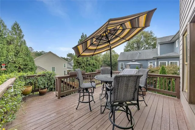 an aerial view of a house with garden space and street view