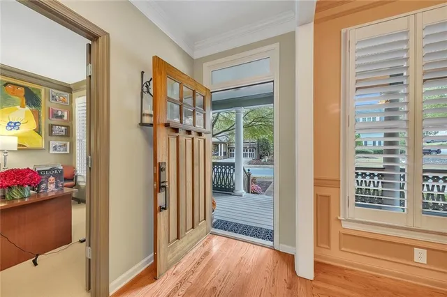 a living room with fireplace furniture and a large window