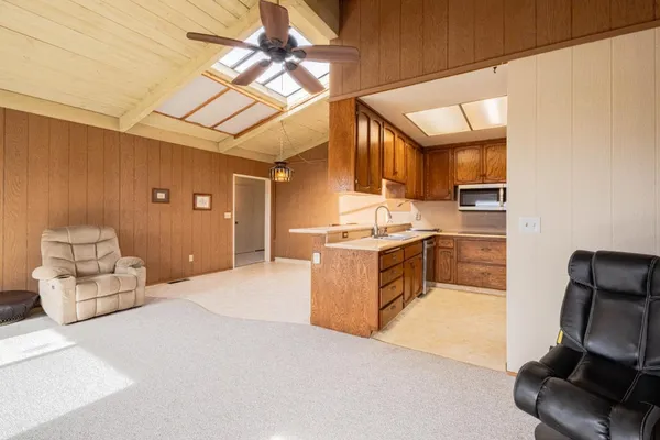 a kitchen with stainless steel appliances granite countertop a sink and a stove