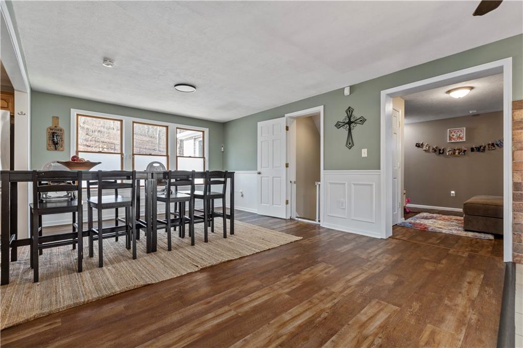 282 Snowden Road Hookstown, PA 15050 - Photo 12 of 25 a view of a dining room with furniture and wooden floor