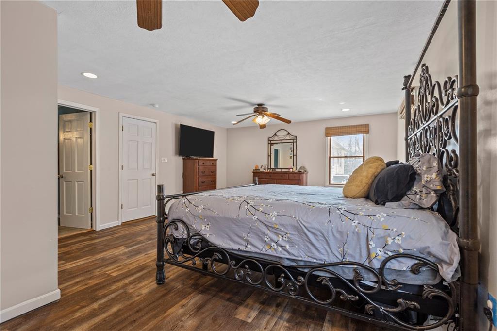 282 Snowden Road Hookstown, PA 15050 - Photo 16 of 25 a bedroom with a bed and wooden floor