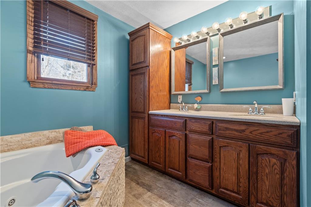 282 Snowden Road Hookstown, PA 15050 - Photo 18 of 25 a bathroom with a sink and a mirror