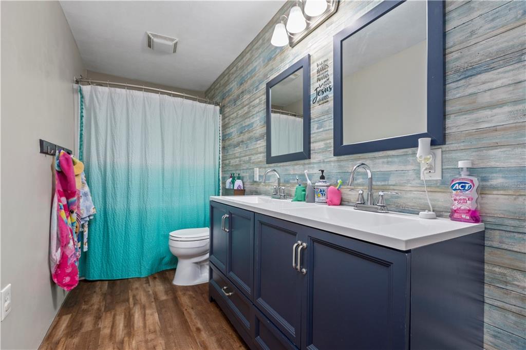 282 Snowden Road Hookstown, PA 15050 - Photo 21 of 25 a bathroom with a sink vanity mirror and toilet