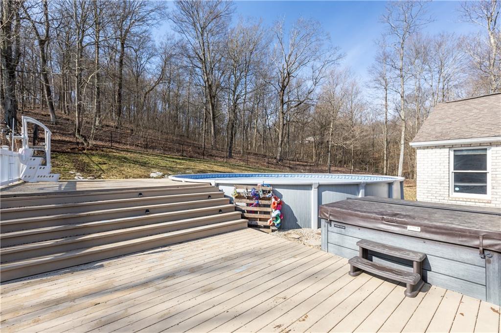 282 Snowden Road Hookstown, PA 15050 - Photo 7 of 25 a view of a wooden deck and trees