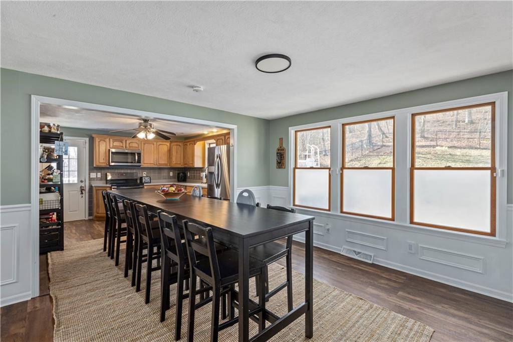 282 Snowden Road Hookstown, PA 15050 - Photo 10 of 25 a view of a dining room with furniture window and wooden floor