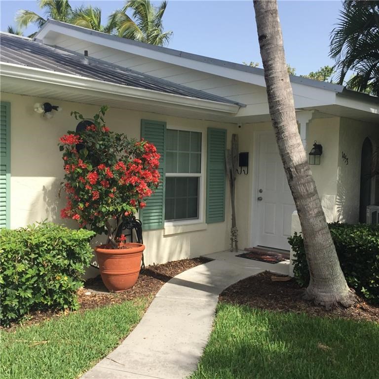 1953 Robalo Drive Vero Beach, FL 32960 - Photo 1 of 12 a front view of a house with a porch