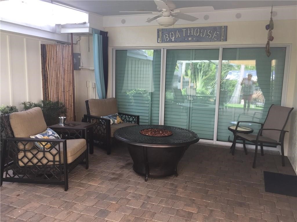 1953 Robalo Drive Vero Beach, FL 32960 - Photo 12 of 12 a living room with furniture and a large window