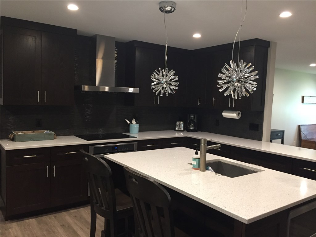 1953 Robalo Drive Vero Beach, FL 32960 - Photo 2 of 12 a kitchen with a sink and a refrigerator
