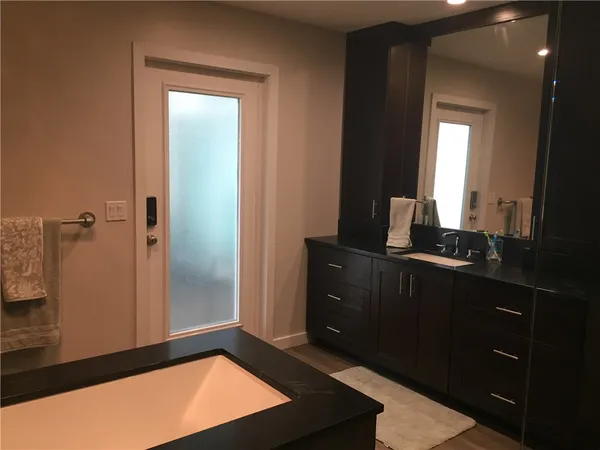 a room with a window and a mirror