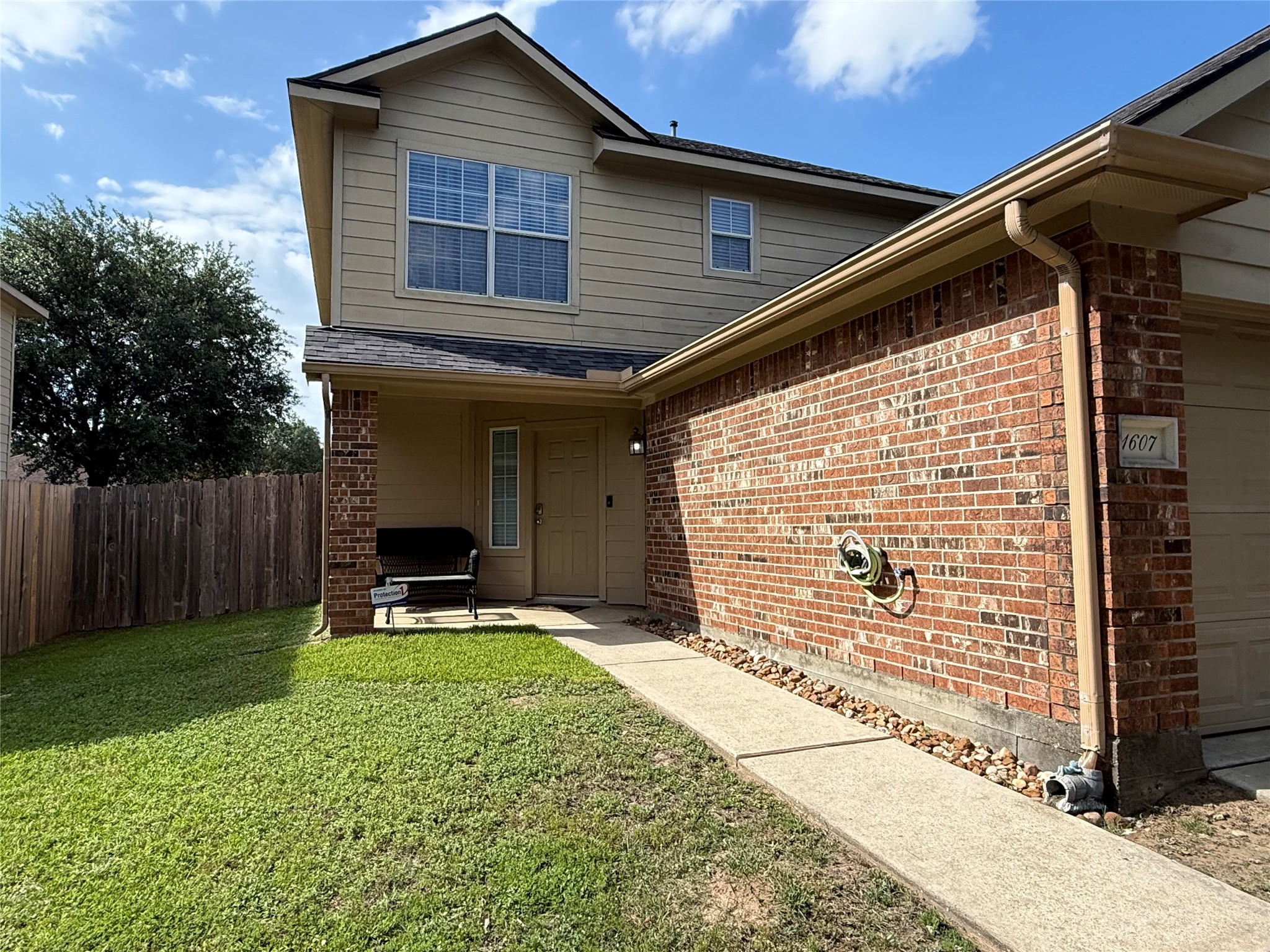 1607 Redbud Grove Court Conroe, TX 77301 - Photo 4 of 21 Covered front porch entry with welcoming seating area