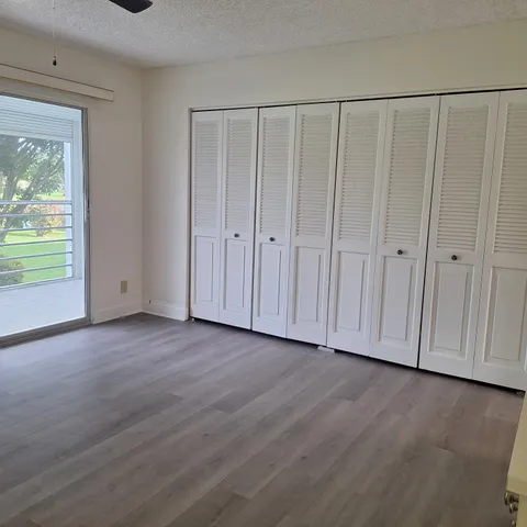 a view of a livingroom with wooden floor