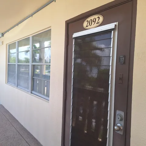 a view of a backyard with swimming pool