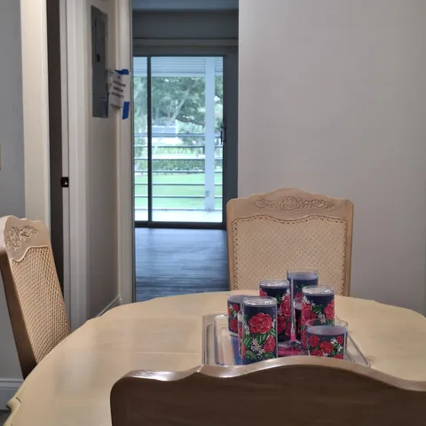 a view of a dining room with furniture window and outside view