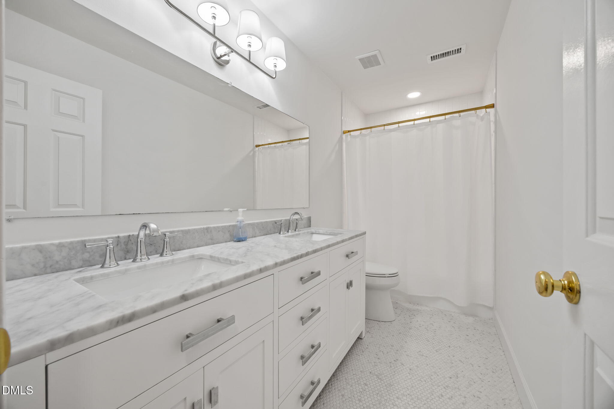 562 Weathergreen Drive Raleigh, NC 27615 - Photo 24 of 47 a bathroom with a granite countertop sink a toilet and a mirror