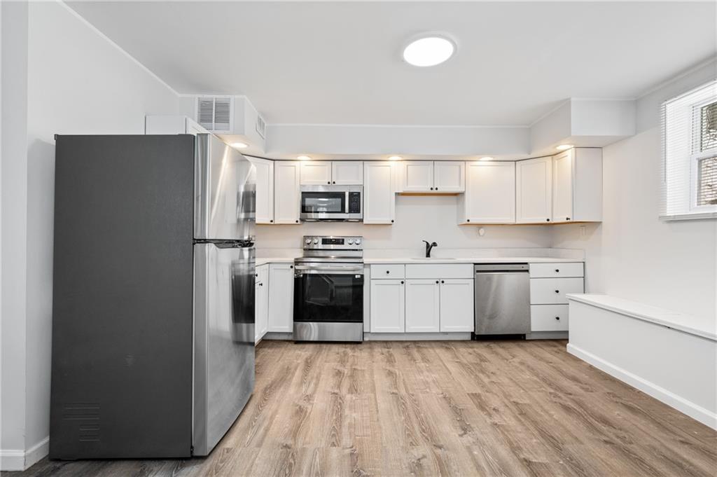 3005 Walton Road Finleyville, PA 15332 - Photo 16 of 31 a kitchen with stainless steel appliances a refrigerator sink and cabinets