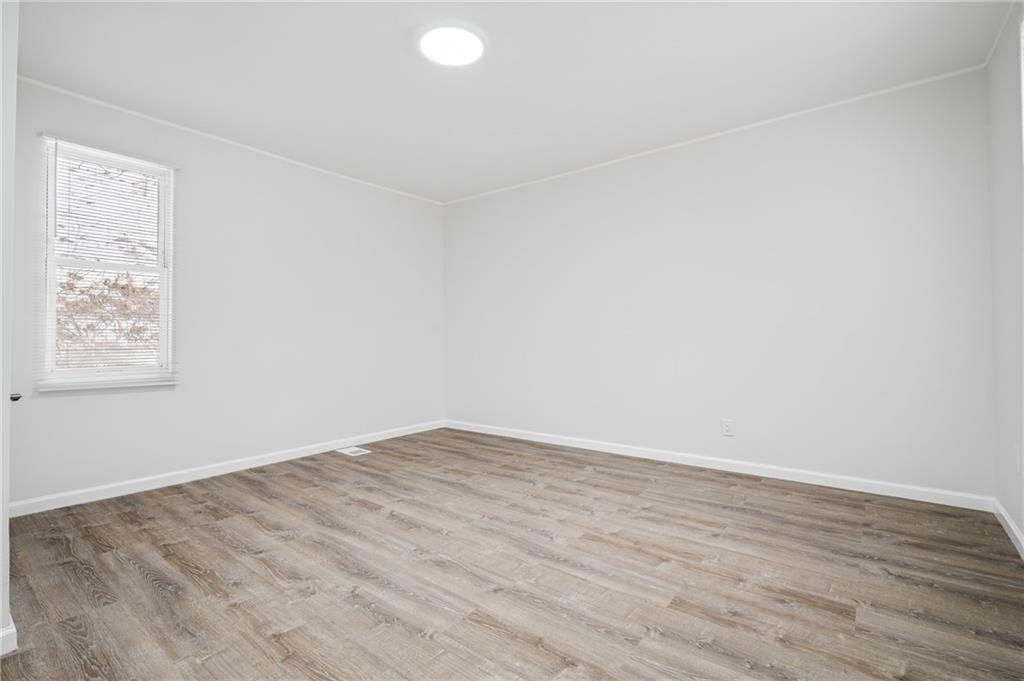 3005 Walton Road Finleyville, PA 15332 - Photo 17 of 31 an empty room with wooden floor and windows