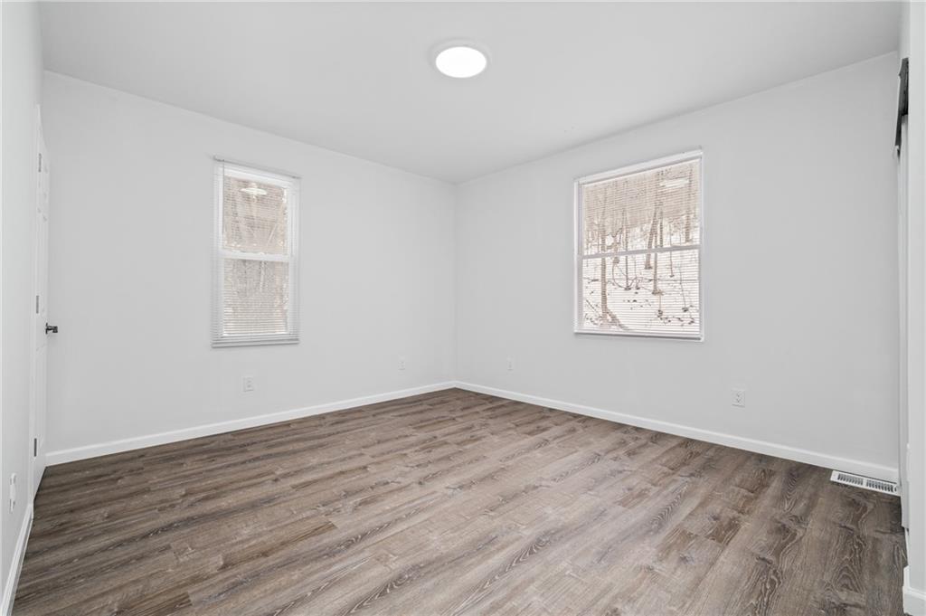 3005 Walton Road Finleyville, PA 15332 - Photo 18 of 31 an empty room with wooden floor and windows