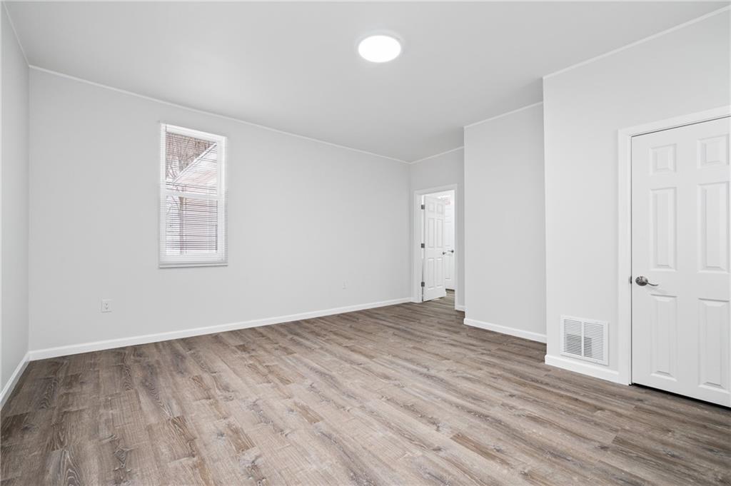 3005 Walton Road Finleyville, PA 15332 - Photo 19 of 31 an empty room with wooden floor and windows