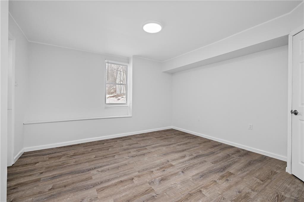 3005 Walton Road Finleyville, PA 15332 - Photo 20 of 31 a view of an empty room with wooden floor and a window