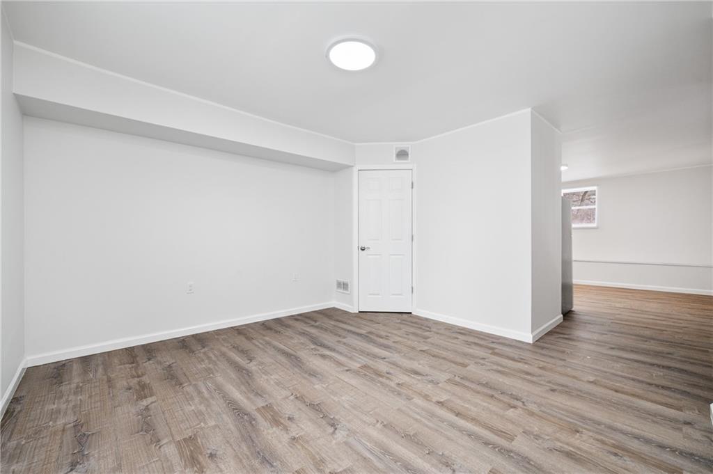 3005 Walton Road Finleyville, PA 15332 - Photo 24 of 31 a view of an empty room with wooden floor