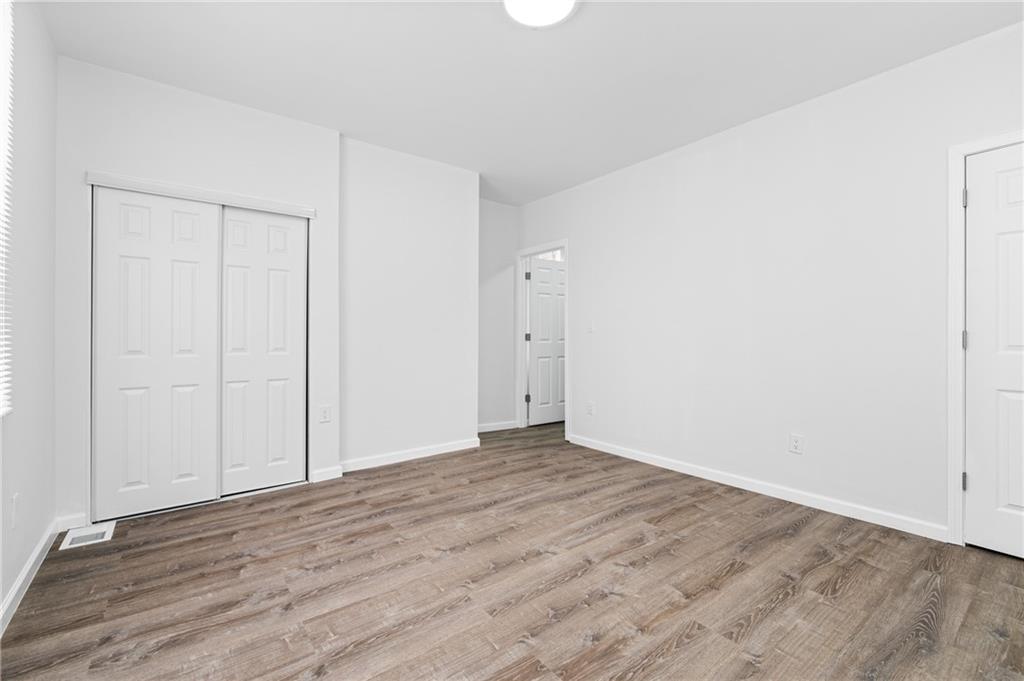 3005 Walton Road Finleyville, PA 15332 - Photo 26 of 31 a view of an empty room with wooden floor