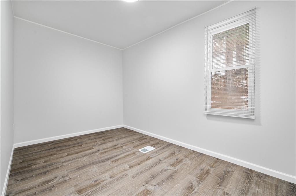 3005 Walton Road Finleyville, PA 15332 - Photo 27 of 31 an empty room with wooden floor and windows