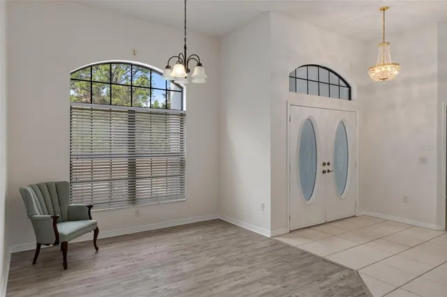 a view of a livingroom with furniture and staircase