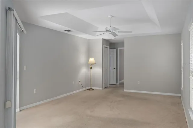 a bathroom with a double vanity sink toilet mirror and bathtub