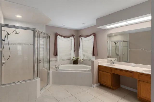 a bathroom with a sink a toilet and bathtub