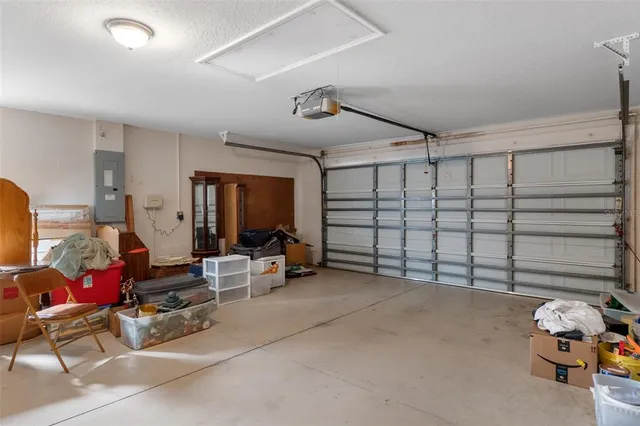 a living room with furniture and a gym machine