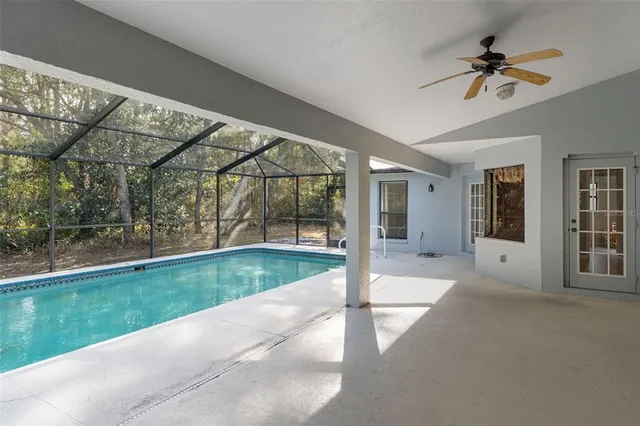 a view of a house with a backyard porch and furniture