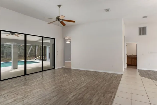 a view of an empty room with glass door
