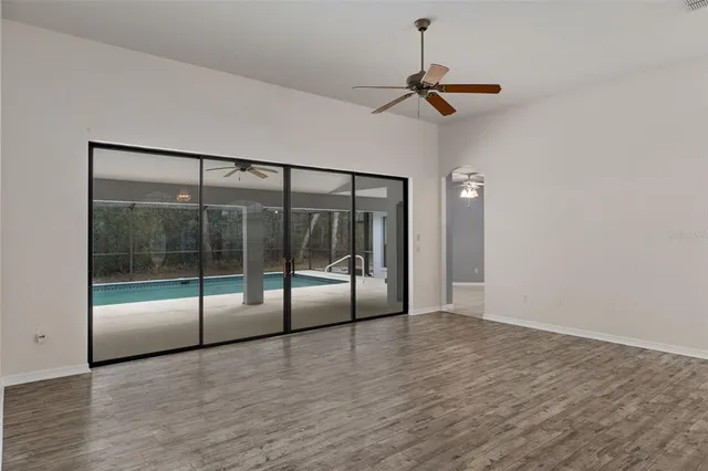 a view of an empty room with glass door