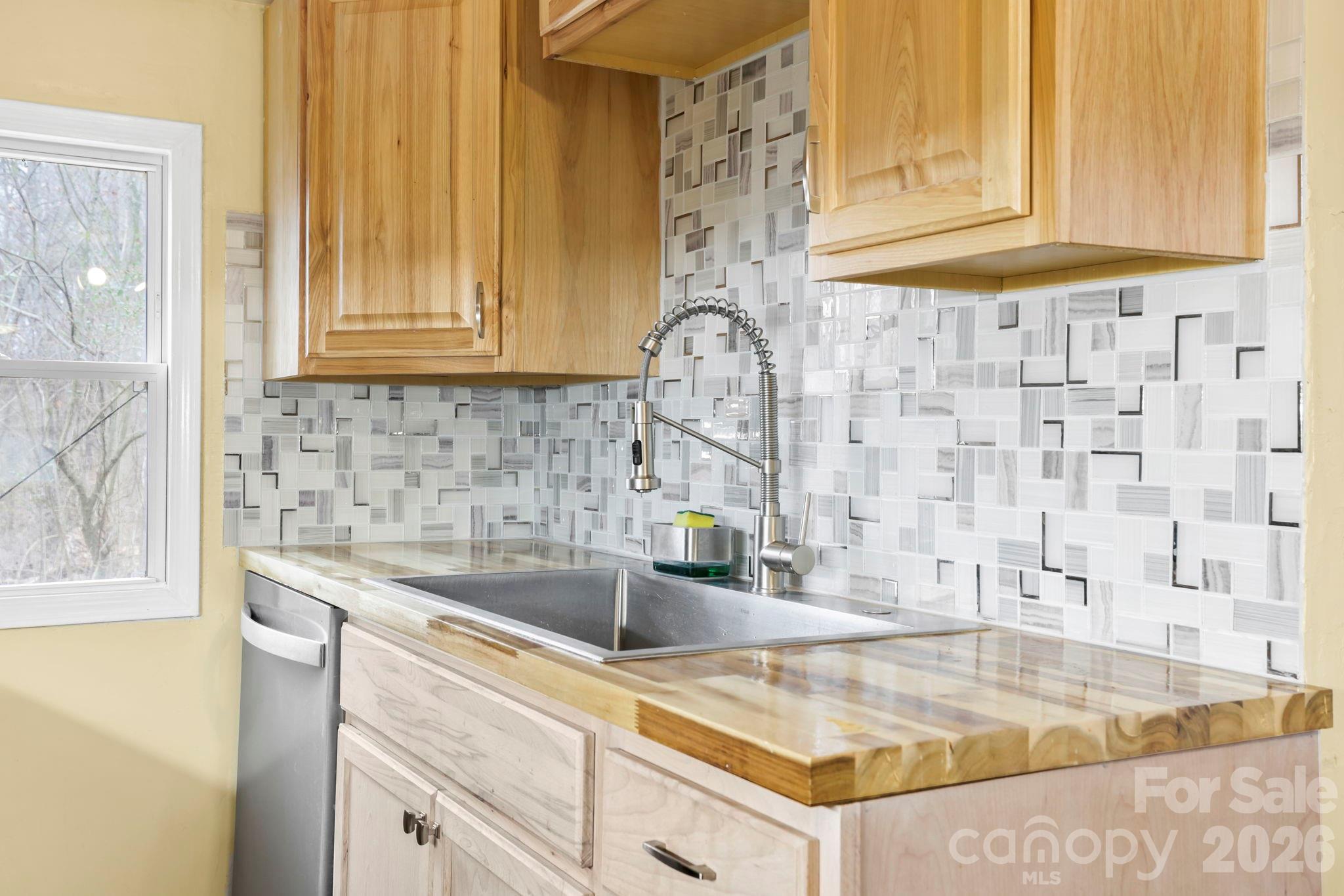 38 Pisgah View Road Asheville, NC 28806 - Photo 12 of 24 a kitchen with granite countertop a sink and a stove