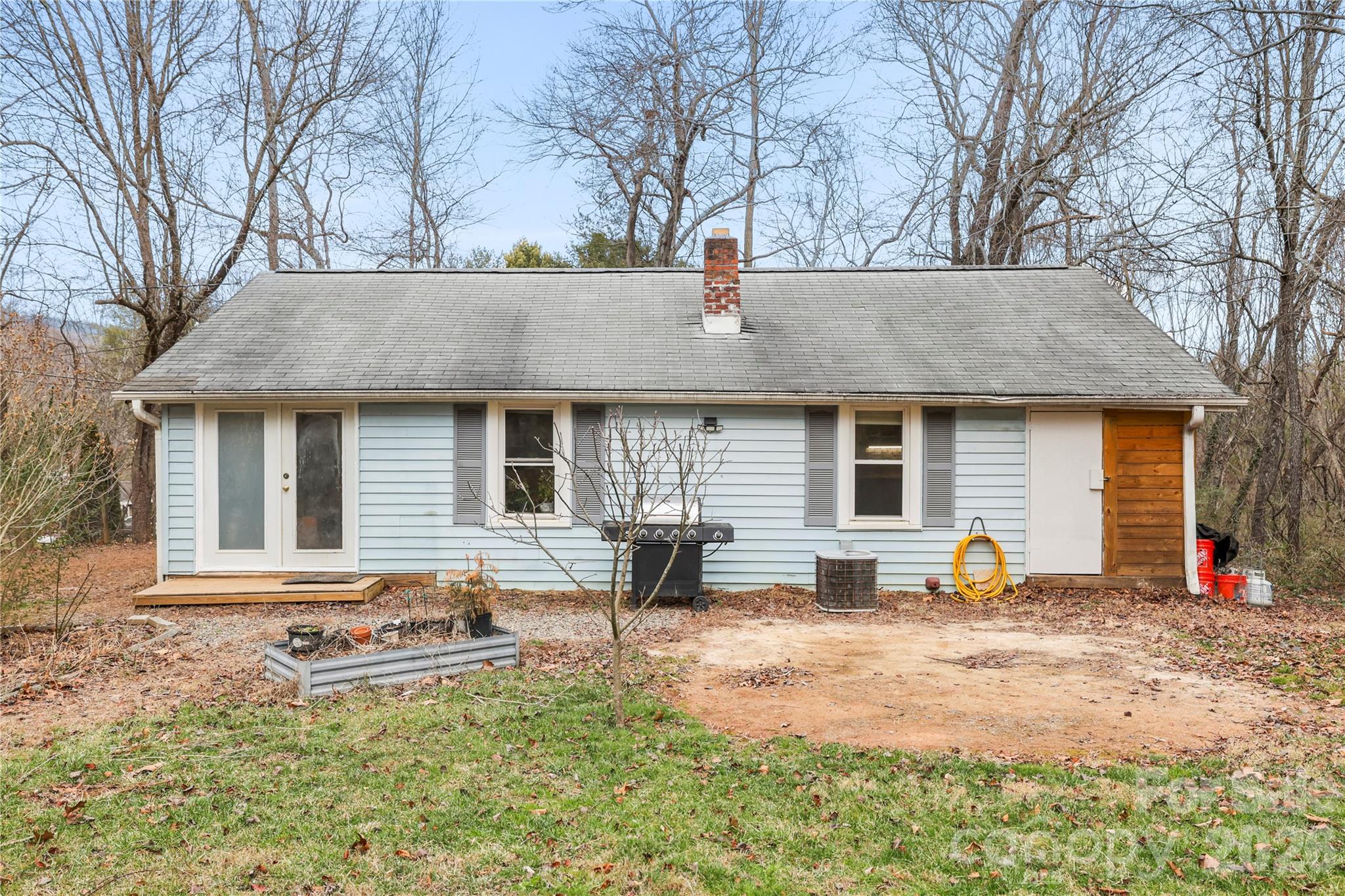 38 Pisgah View Road Asheville, NC 28806 - Photo 23 of 24 a front view of a house with a yard and outdoor seating