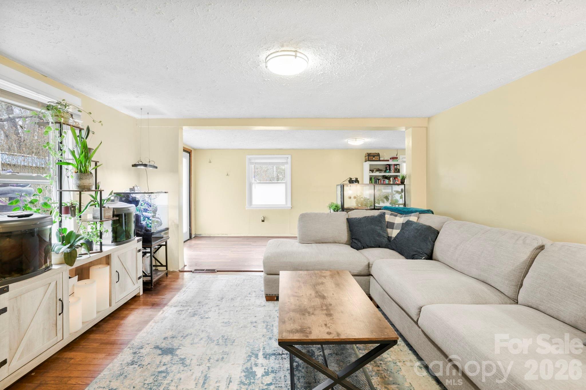 38 Pisgah View Road Asheville, NC 28806 - Photo 5 of 24 a living room with furniture and a flat screen tv