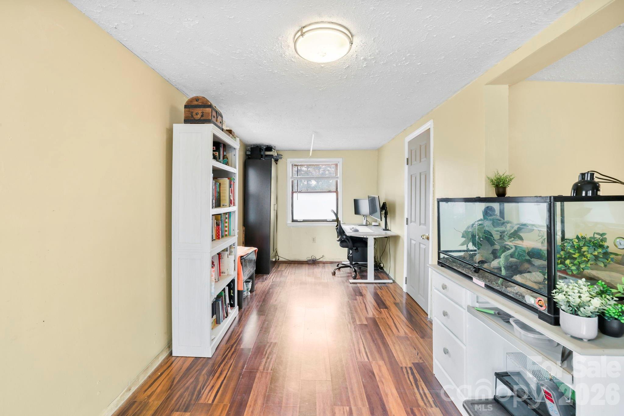 38 Pisgah View Road Asheville, NC 28806 - Photo 7 of 24 a view of a livingroom with furniture and a flat screen tv