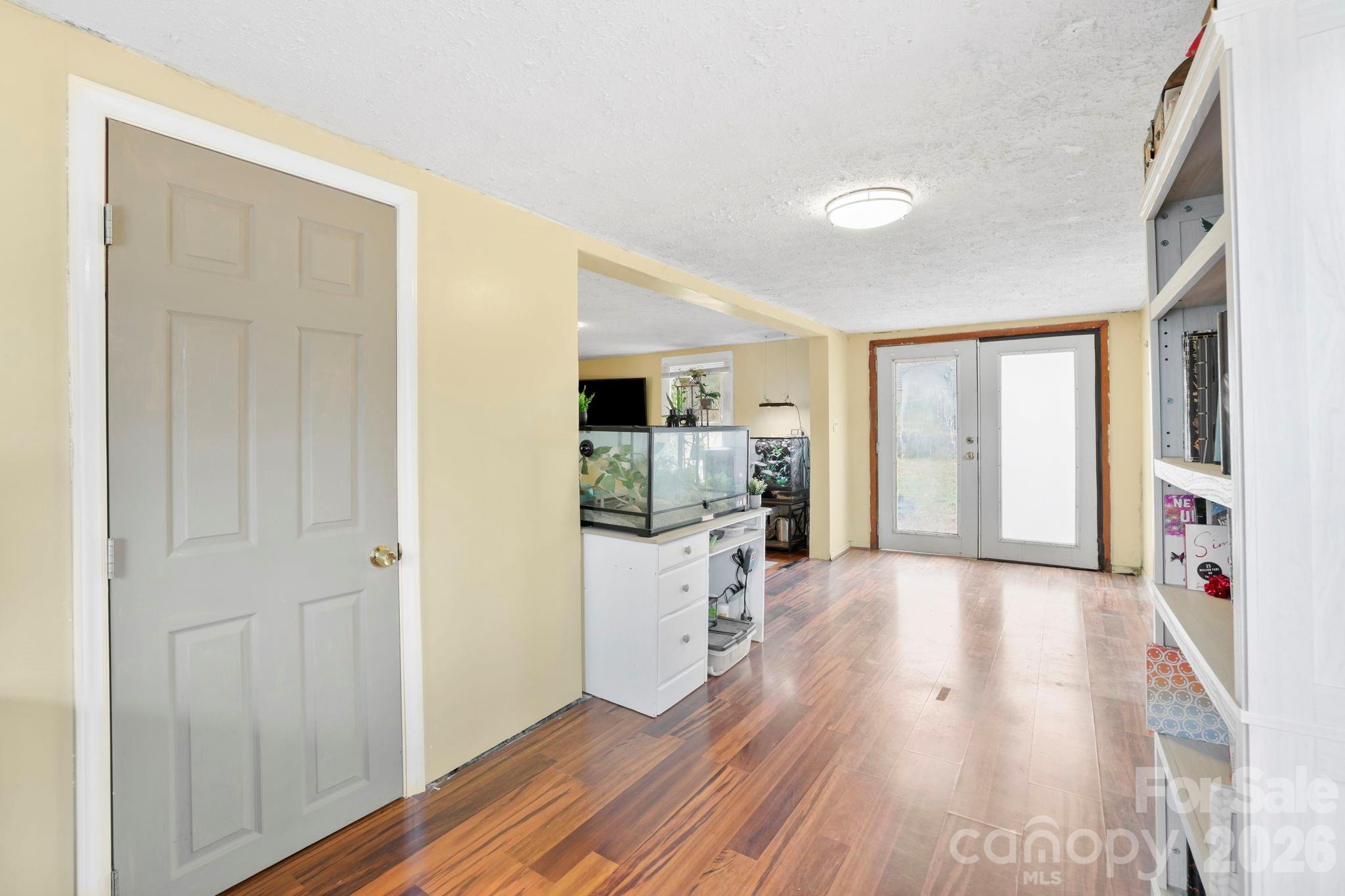 38 Pisgah View Road Asheville, NC 28806 - Photo 8 of 24 a open kitchen with white cabinets and wooden floor